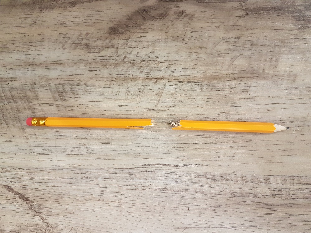 A pencil broken in half